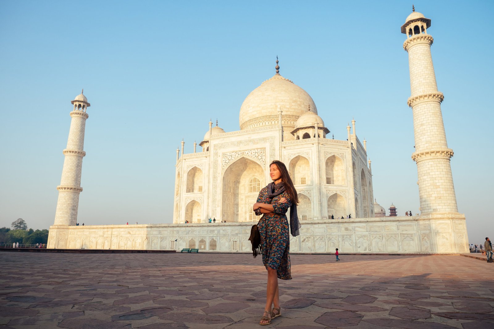 young girl tourist looking to the Taj Mahal in Agra, India . concept of culture, tourism and religion.